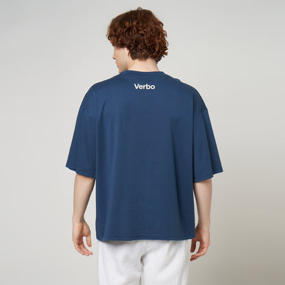 Model wearing the VERBO oversized tee from behind, showcasing the loose silhouette and high-neck "Verbo" branding.
