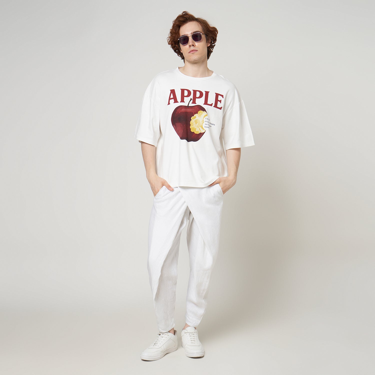 Model wearing the VERBO Apple Boxy Oversized Tee in Broken White with linen pants for a clean streetwear look.