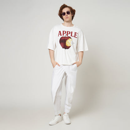 Model wearing the VERBO Apple Boxy Oversized Tee in Broken White with linen pants for a clean streetwear look.