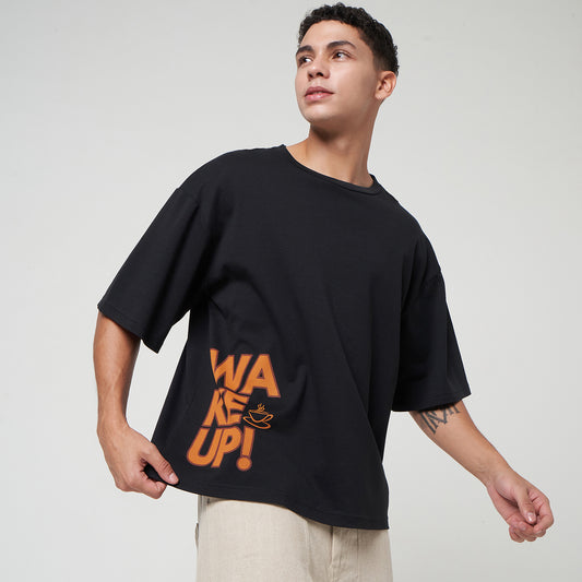 Man wearing the VERBO Coffee Boxy Oversized Tee in Noir, showing the relaxed streetwear fit and heavyweight black cotton.