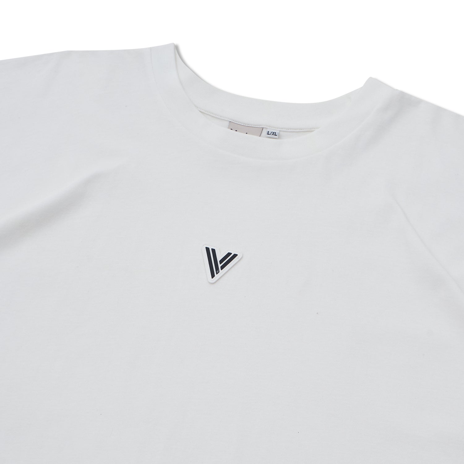 Close-up of the VERBO white tank neckline with brand tag and high-quality white patch V logo detail.