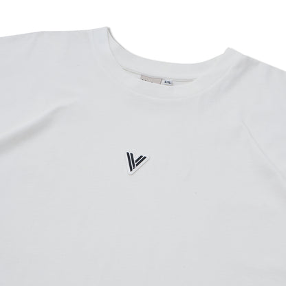 Close-up of the VERBO white tank neckline with brand tag and high-quality white patch V logo detail.