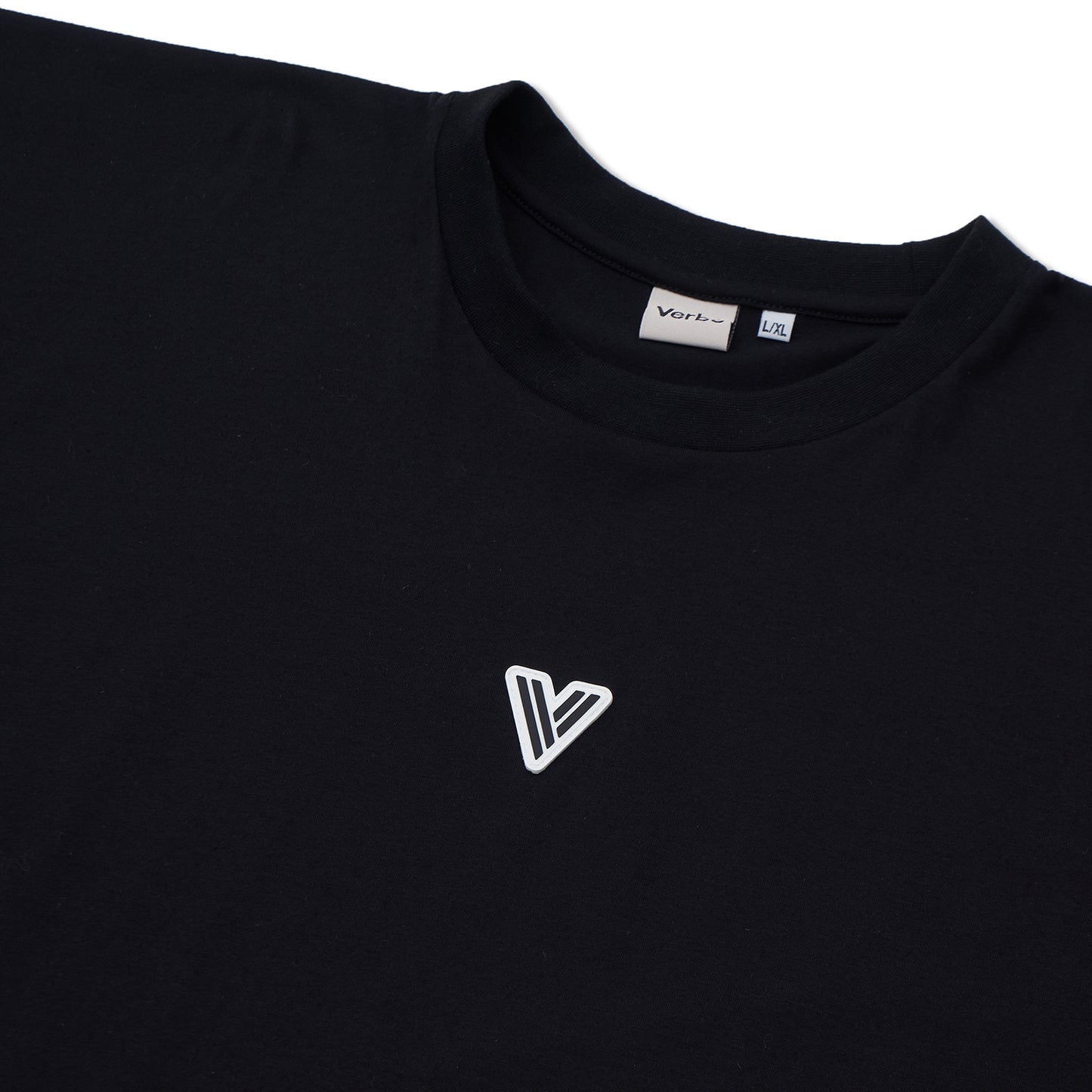 Close-up of the VERBO Noir tank neckline with brand tag and high-quality white patch V logo detail.