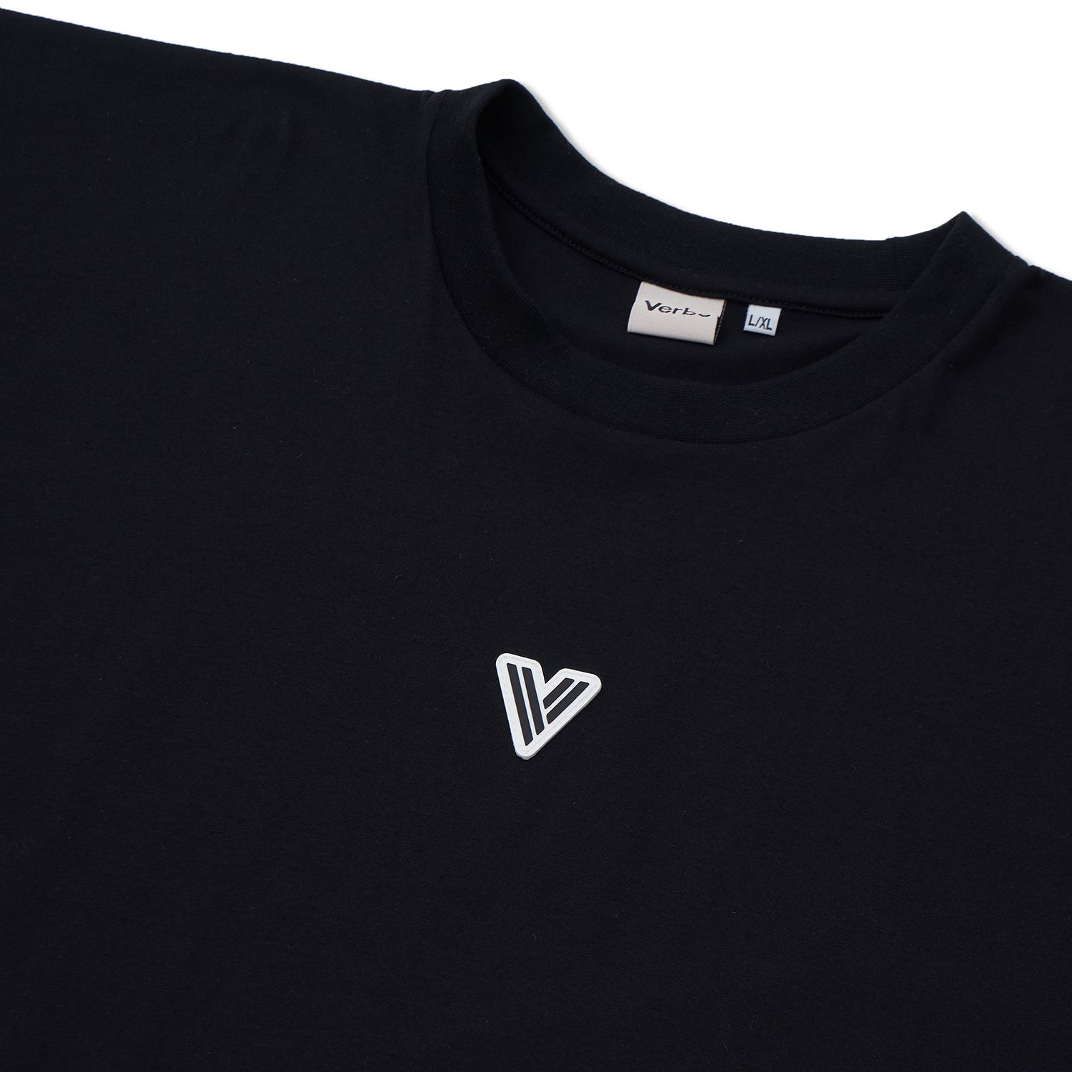 Close-up of the VERBO Noir tank neckline with brand tag and high-quality white patch V logo detail.